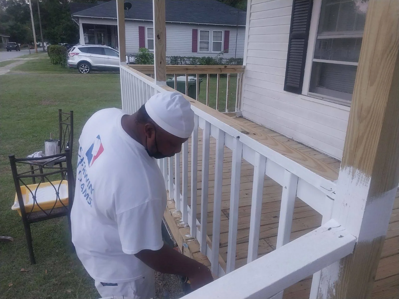 Mr. Shilow painting the exterior of a home in Timmonsville, S.C.